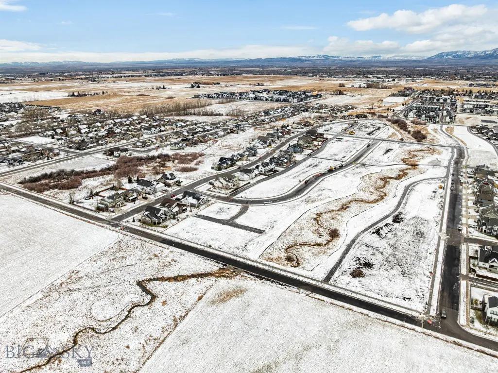 Snow-covered Meadow Bridge roads, homesites, and surrounding homes